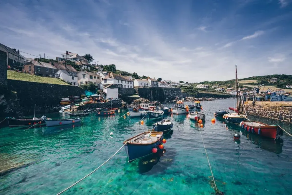 A Picturesque Landscape Of The Idyllic Harbour Fishing Village Of Coverack In Cornwall