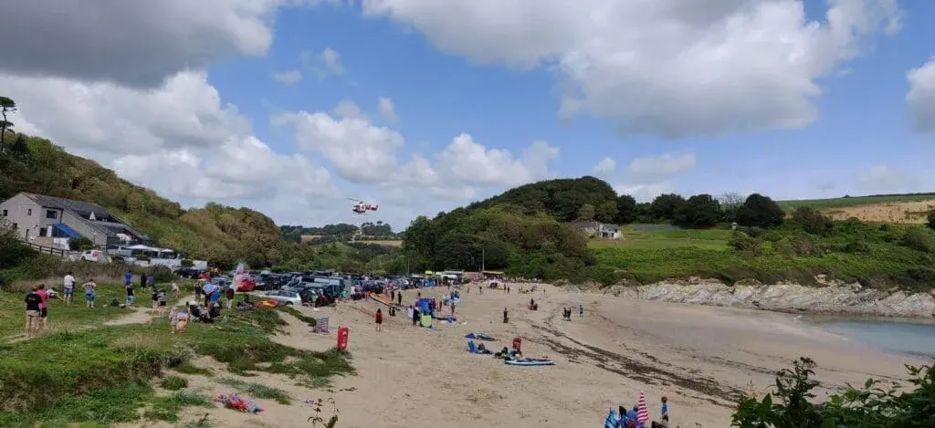 Maenporth Beach, Cornwall 20 august, 2019. beachgoers a Maenporth, Cornwall were cleared off the beach to allow an air ambulance to land to pick up a casualty. the air ambulance landed and then took off again to land in a nearby field.
