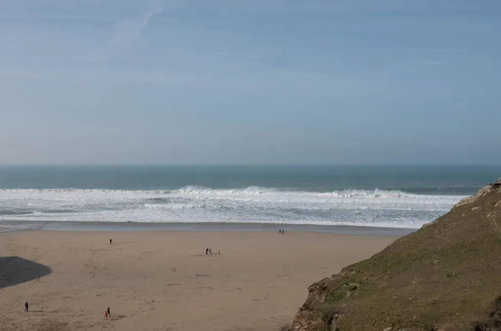 Tourists enjoy the sun, sea and sand at Chapel Porth, Cornwall