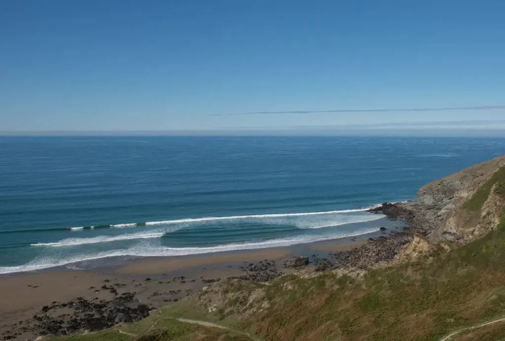 Overlooking Tregardock Beach from the cliffs on a summer day in Cornwall