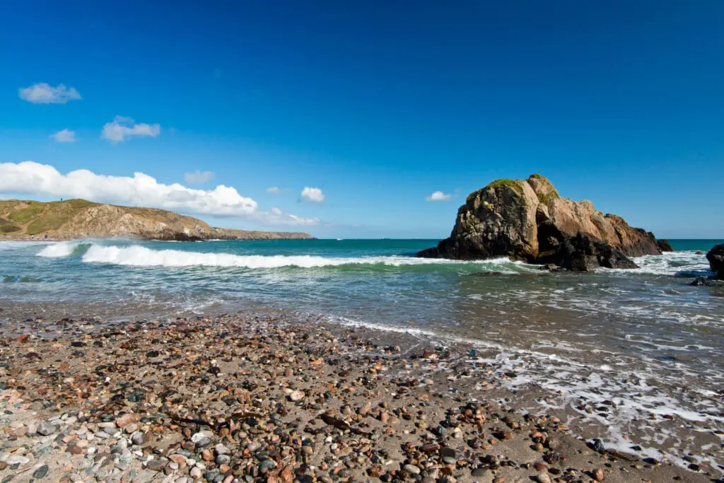 The rugged beach on a summer afternoon at Kennack Sands Beach on the Lizard Peninsula, Cornwall