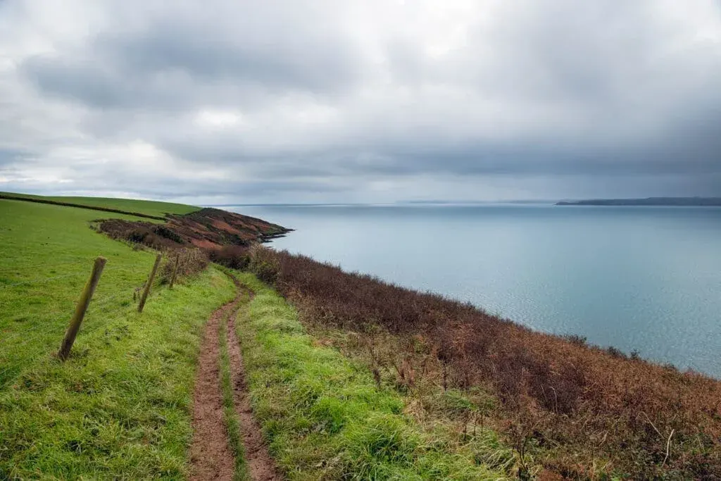 The South West Coast Path near Polkerris Beach on the south coast of Cornwall.