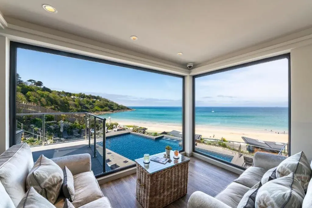 Lounge overlooking outside spa/swimming pool and beach, Carbis Bay and Spa Hotel, Cornwall